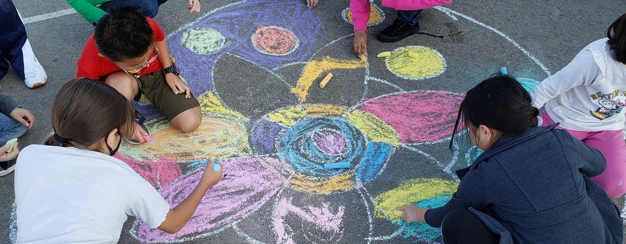 Students doing Rangoli Art on the Blacktop on Diwali
